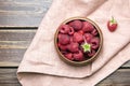 Fresh raspberries in wooden bowl on brown table. Red ripe raspberries, sweet berries Royalty Free Stock Photo