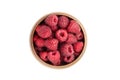 Fresh raspberries in wooden bowl isolated on white background. Red sweet raspberries, top view Royalty Free Stock Photo