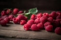 A lot of fresh raspberry on old wooden table, close up, dark background