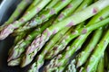 Fresh raw asparagus and assorted spring vegetables cooking in the kitchen from a top perspective Royalty Free Stock Photo