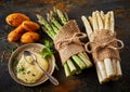 Fresh raw asparagus spears with mayonnaise