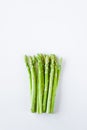 Fresh raw asparagus. White background, top view, space for text. Royalty Free Stock Photo