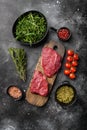 Fresh raw Beef meat Rump Steak, on black dark stone table background, top view flat lay Royalty Free Stock Photo