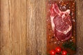 Fresh, raw beef steak on a wooden board Royalty Free Stock Photo