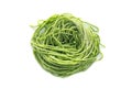 Fresh raw bio nest spaghetti pasta with spinach