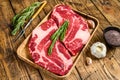 Fresh Raw Black Angus prime beef chuck eye roll steaks. wooden background. Top view