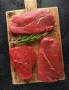 Fresh Raw braising beef steak on wooden board Royalty Free Stock Photo
