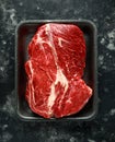 Fresh Raw braising steak on black tray Royalty Free Stock Photo