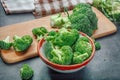 Fresh raw broccoli in a wooden bowl on a dark background Royalty Free Stock Photo