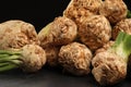 Fresh raw celery roots on black table, closeup Royalty Free Stock Photo