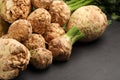 Fresh raw celery roots on black table, closeup Royalty Free Stock Photo