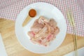 Fresh Raw Chicken Cartilage on a White plate and seasoning Royalty Free Stock Photo