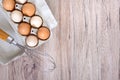 Fresh raw chicken eggs in carton egg box on wooden background Royalty Free Stock Photo