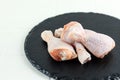 Fresh Raw Chicken Leg Drumstick on Slate Plate Royalty Free Stock Photo