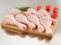 Fresh raw chicken legs on cutting board Royalty Free Stock Photo