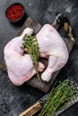 Fresh raw chicken legs on a cutting board. Black background. Top view Royalty Free Stock Photo