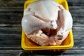 Fresh raw chicken with skin and bones, the whole chicken with breasts, legs, thighs, chicken meat that is ready for baking, Royalty Free Stock Photo