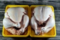 Fresh raw chicken with skin and bones, the whole chicken with breasts, legs, thighs, chicken meat that is ready for baking, Royalty Free Stock Photo