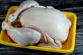 Fresh raw chicken with skin and bones, the whole chicken with breasts, legs, thighs, chicken meat that is ready for baking, Royalty Free Stock Photo