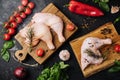 Fresh raw chicken thighs, legs on a cutting board with spices Royalty Free Stock Photo
