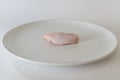 Fresh raw chicken wings on white dish with white background