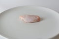 Fresh raw chicken wings on white dish with white background