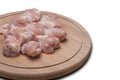 Fresh raw chicken wings on a wooden cutting board.Isolate