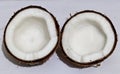 Fresh raw coconut in two pieces isolated on white background. Royalty Free Stock Photo