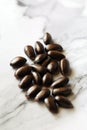 Fresh raw coffee beans on white table being prepared to be roasted