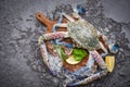 Fresh raw crab with ingredients lemon rosemary and lettuce for making cooked food on ice at market - Seafood frozen , Blue Royalty Free Stock Photo