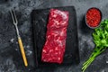 Fresh raw denver beef marble meat steak. Black background. Top view