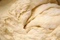 Fresh raw dough background, top view, making yeast dough