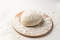 Fresh raw dough on wooden board isolated on white background