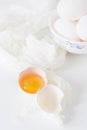 Fresh raw egg bowl on white background. food flat lay on kitchen table Royalty Free Stock Photo