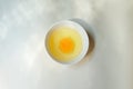 Fresh raw egg bowl on white background with Light and shadow from the window in the morning. Royalty Free Stock Photo