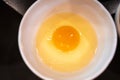 Fresh raw egg in a white bowl Royalty Free Stock Photo