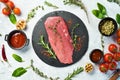 Fresh and raw fillet meat. Whole piece of beef tenderloin steaks set with spices and herbs. Meat. Royalty Free Stock Photo