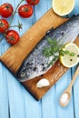Fresh raw fish and food ingredients on table Royalty Free Stock Photo