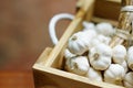 Fresh raw garlic wooden box, copy space, outdoor kitchen raw ingredient concept Royalty Free Stock Photo