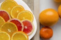 Fresh raw grapefruit and oranges citrus x paradisi on wooden background Royalty Free Stock Photo