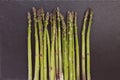 Fresh raw green asparagus spears on black background, copy space Royalty Free Stock Photo