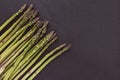 Fresh raw green asparagus spears on black background, copy space Royalty Free Stock Photo