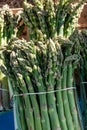 Fresh raw green asparagus vegetables for sale in french Provencal farmers market in Arles, France