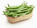 Fresh and raw green beans green round beans in wicker basket. Royalty Free Stock Photo