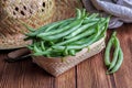 Fresh and raw green beans green round beans in wicker basket. Royalty Free Stock Photo