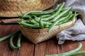 Fresh and raw green beans green round beans in wicker basket. Rustic and homemade look. Royalty Free Stock Photo