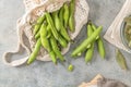 Fresh and raw green broad beans on kitchen table Royalty Free Stock Photo