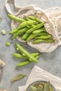 Fresh and raw green broad beans on kitchen table Royalty Free Stock Photo