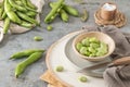 Fresh and raw green broad beans on kitchen table Royalty Free Stock Photo