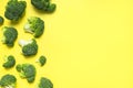 Fresh raw green broccoli on yellow background. Healthy vegetables, diet vegan organic food, vitamins. Creative food Royalty Free Stock Photo